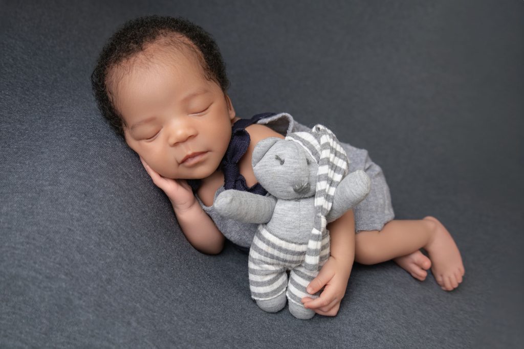 When Is the Best Time for a Newborn Photoshoot in Durban (And What If You Miss It?) Newborn baby holding a teddy